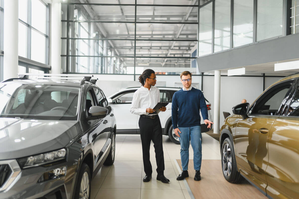 Modern car dealership showroom with vehicles and professional infrastructure